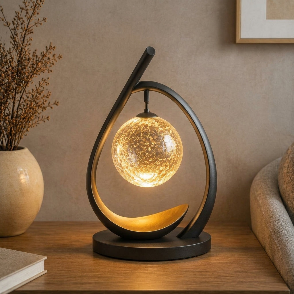 Nuvorly™ HaloArc Suspended Orb Table Lamp – Sculptural Black Frame Accent Light with Textured Glass Globe & Warm Ambient Glow